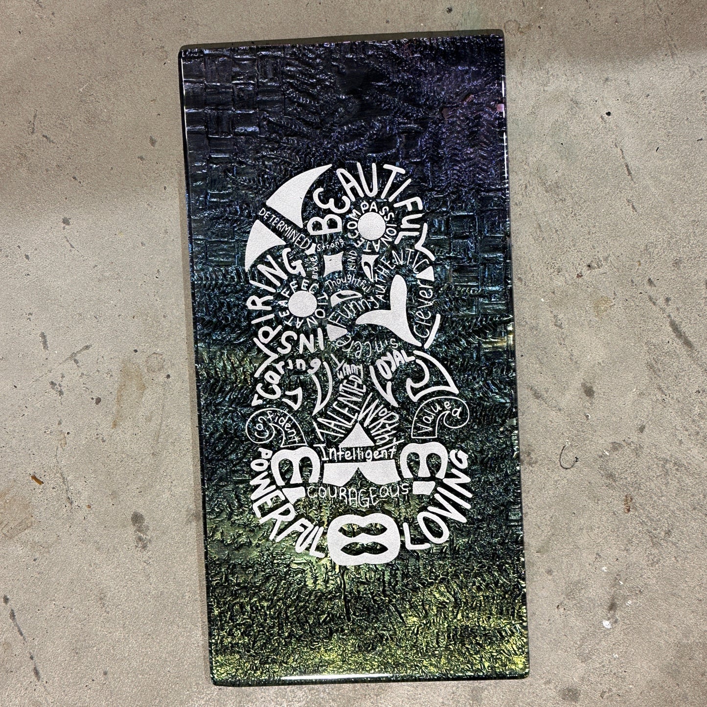 glass art affirmations in the shape of an NZ tiki