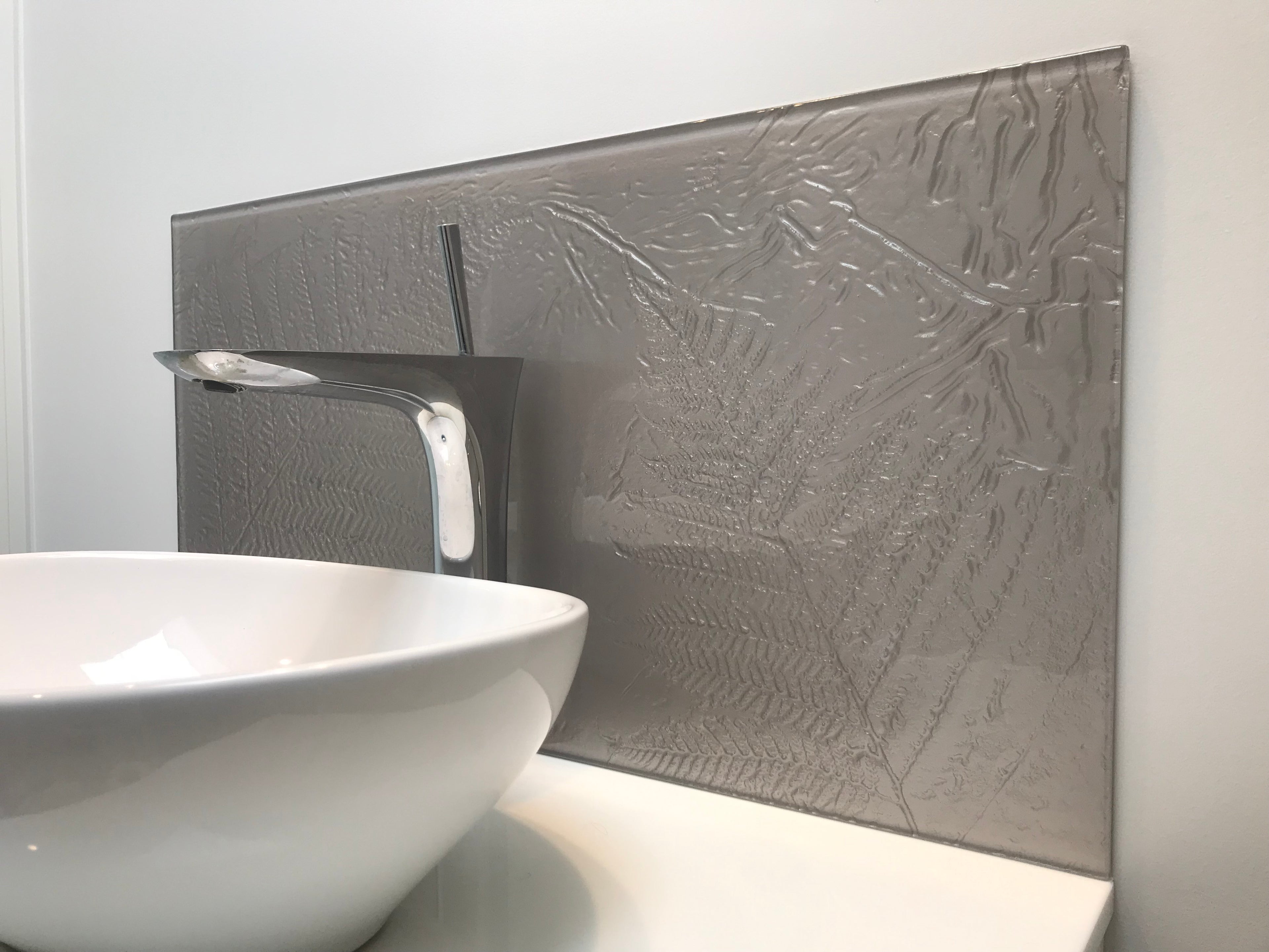 Who said glass splashbacks were just for the kitchen?