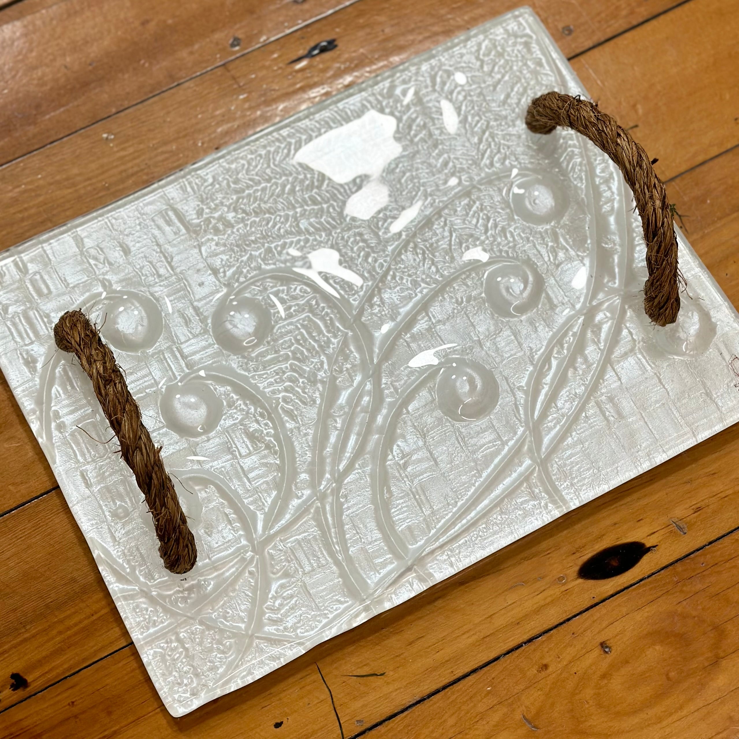 White rope handle platter in koru and fern pattern